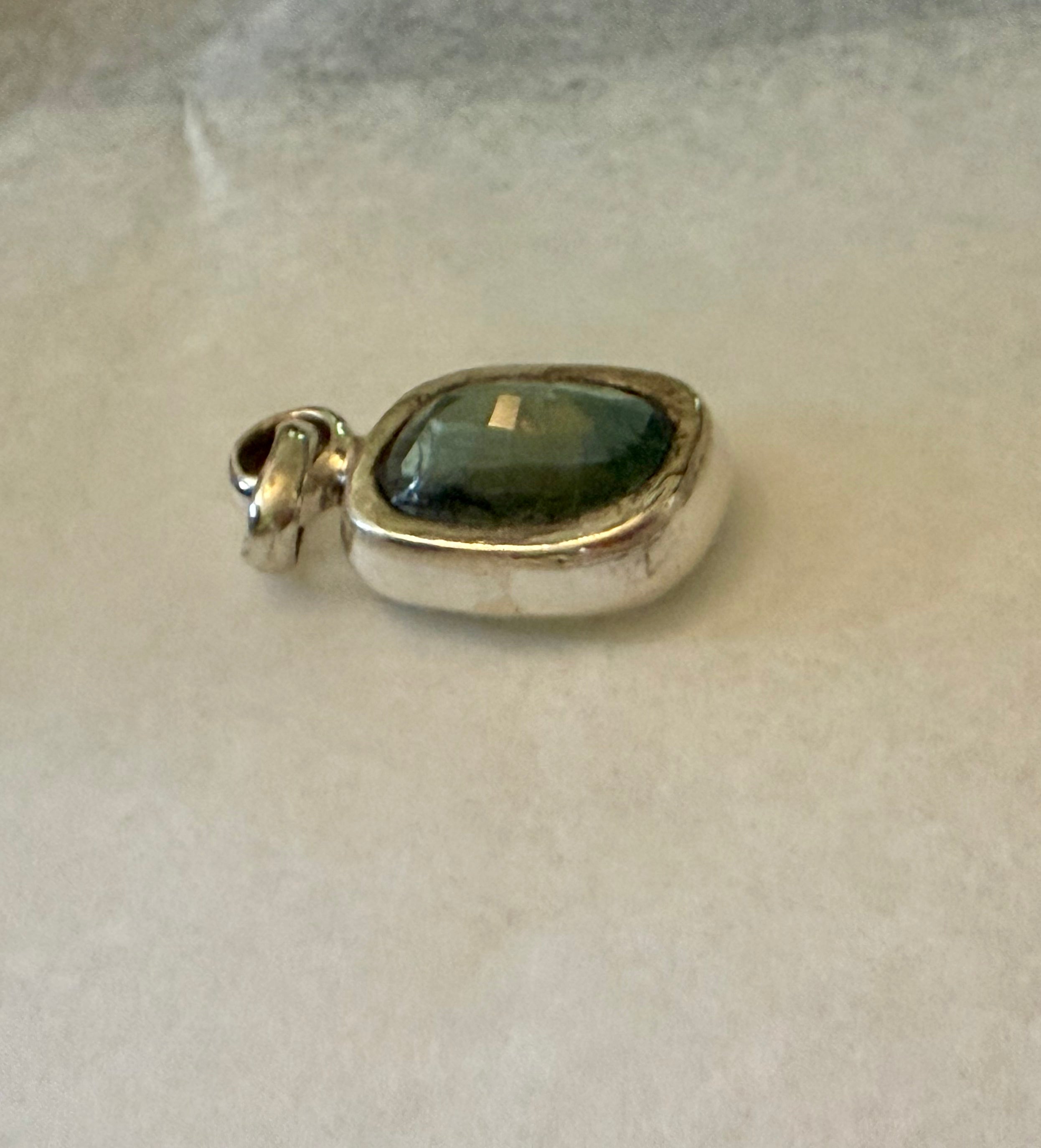 Large 39.50 carat Natural Blue Green Tourmaline Pendant. Sterling Silver.