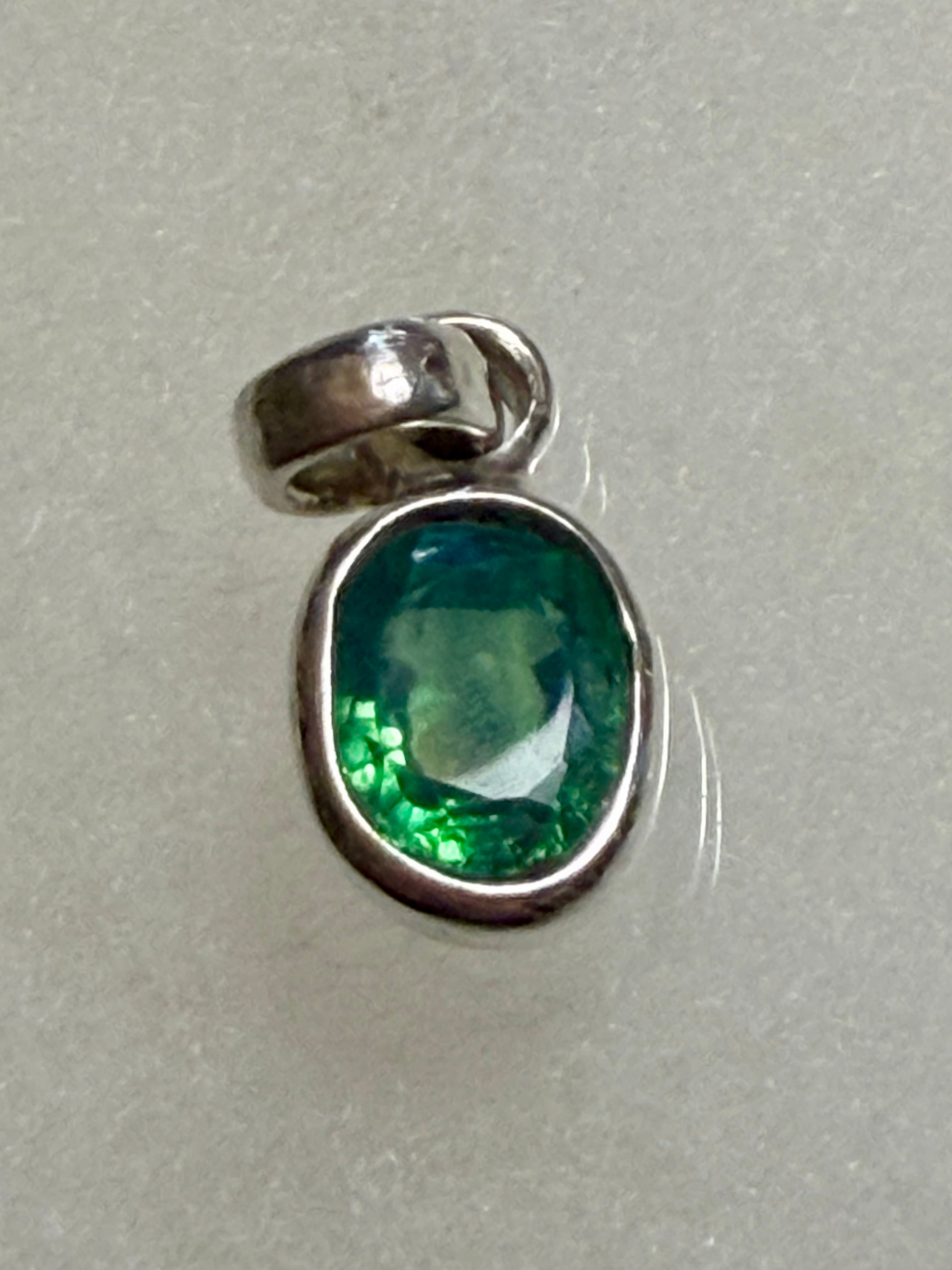4.95 carat Natural Paraiba Tourmaline Pendant. 925 Sterling Silver.